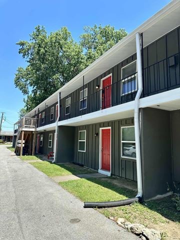 Louisville apartment for rent - A long building with a red door in the middle.