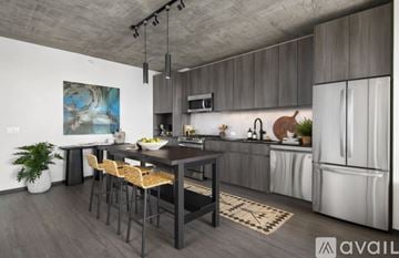 Chicago house for rent - A modern kitchen with a dining table and chairs.