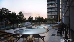 Chicago house for rent - A modern outdoor pool area with lounge chairs and a hot tub.