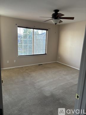 Aurora townhouse for rent - A dining room with a table and chairs.