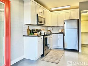 Phoenix apartment for rent - A bathroom with a white tub, toilet, and sink.