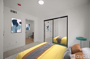 Los Angeles apartment for rent - A bedroom with a bed in the center and a mirror on the wall.