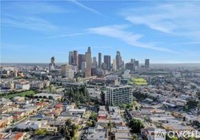 Los Angeles apartment for rent - A cityscape with a mix of residential and commercial buildings under a clear sky.