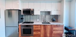 Los Angeles condo for rent - A kitchen with wooden cabinets and a stainless steel refrigerator.