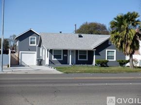 Stockton house for rent - A house with a garage and a driveway in front.