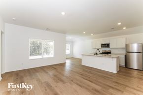 Oklahoma City house for rent - A kitchen with wooden floors and white walls.