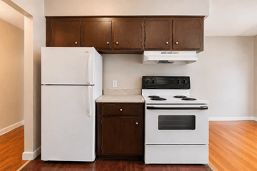 Vancouver apartment for rent - A white refrigerator and a white stove in a kitchen.