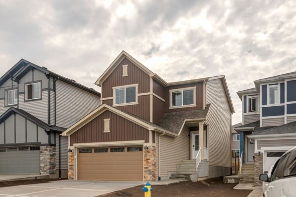 Edmonton apartment for rent - A modern house with a garage is shown in the image.