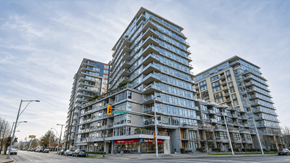 Vancouver apartment for rent - A large, modern apartment building with many windows and balconies.