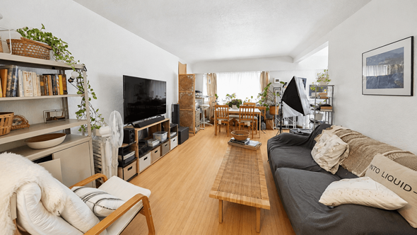 Vancouver apartment for rent - A living room with a grey couch and a wooden coffee table.