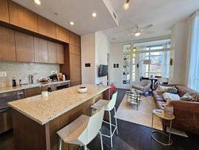 Vancouver apartment for rent - A kitchen with a counter and chairs.
