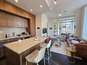Vancouver apartment for rent - A kitchen with a counter and chairs.