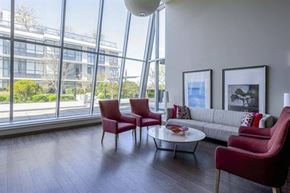 Vancouver apartment for rent - A living room with a couch, two chairs, and a coffee table.
