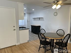 Hemet apartment for rent - A dining room with a round table and chairs.