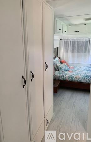 Key West apartment for rent - A bedroom with a bed and a wardrobe.