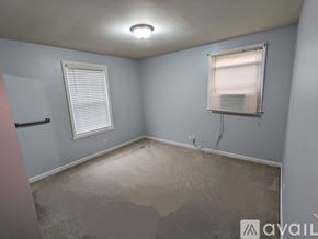 Nashville house for rent - A room with a window and a wall socket.