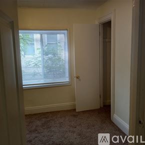 Saint Paul apartment for rent - A room with a carpeted floor and a window with blinds.