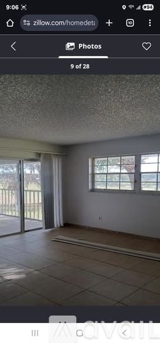 Ocala apartment for rent - A room with a sliding glass door and a window.