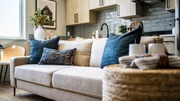 Garden City apartment for rent - A living room with a couch and a basket on it.