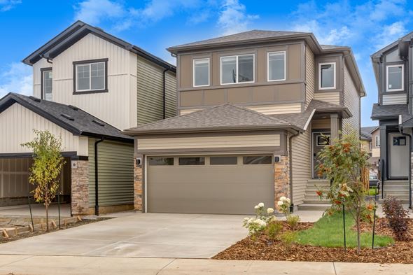 Edmonton apartment for rent - A modern house with a garage and a driveway.