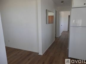 Landers apartment for rent - A room with wooden floors and white walls.