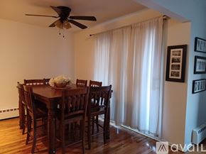 Piermont apartment for rent - A dining room with a wooden table and chairs.