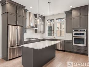Columbus house for rent - A modern kitchen with a large island in the center.