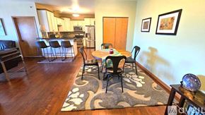 Appleton apartment for rent - A dining room with a table set for four.
