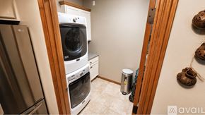 Appleton apartment for rent - A kitchen with white cabinets and a black countertop.