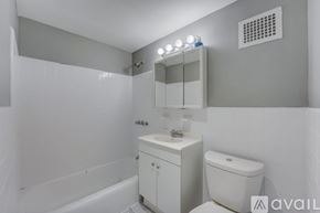Ewing Township apartment for rent - A bathroom with a white toilet and sink.