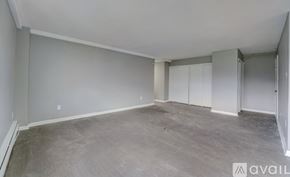 Ewing Township apartment for rent - A spacious room with grey flooring and white walls.