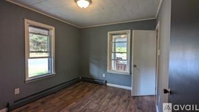 Mifflin house for rent - A room with a door, a window, and a wall.