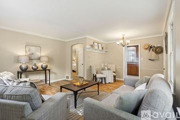 Bay Village house for rent - A living room with a grey couch and a coffee table.