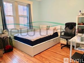 Boston apartment for rent - A bedroom with a bed, desk, and chair.