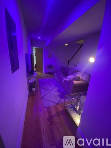 Boston apartment for rent - A living room with a couch and a television.