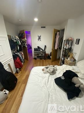 Boston apartment for rent - A bedroom with a bed, a wardrobe and a chair.