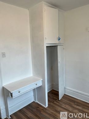 Pittsburgh house for rent - A white desk with drawers is in a room with a white wall and a white door.