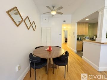 Boston apartment for rent - A kitchen with wooden cabinets and a white counter.