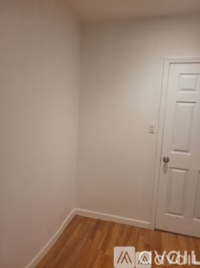 Philadelphia apartment for rent - A white door is in a room with white walls.
