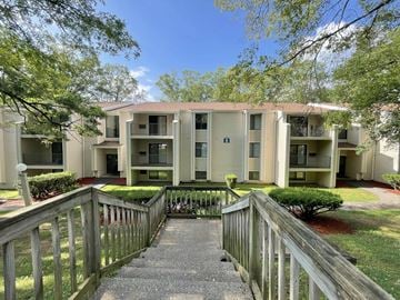 State College apartment for rent - A building with a wooden fence in front of it.