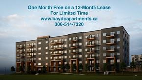 Saskatoon apartment for rent - A building with a sign offering a free month on a lease.