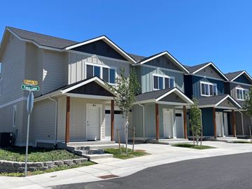 Wenatchee apartment for rent - A row of houses with a stop sign in front of them.
