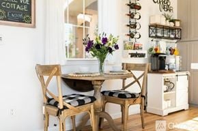Buellton house for rent - A dining room with a table set for two and a chalkboard sign on the wall.