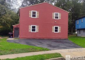 Gloucester Township apartment for rent - A red house with a car parked in front.