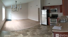 Middletown apartment for rent - A kitchen with a refrigerator, oven, and microwave.