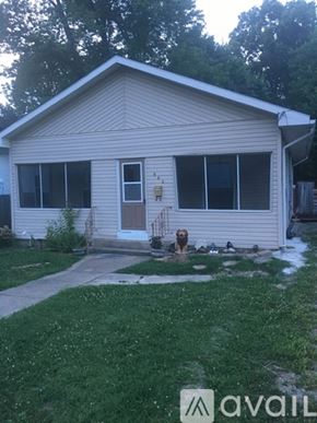 Carterville house for rent - A house with a dog in front of it.