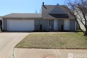 Edmond house for rent - A house with a grey roof and a white garage door.