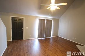 Edmond house for rent - A room with a ceiling fan and wooden flooring.