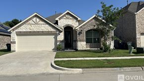 Garland house for rent - A house with a garage and a driveway in front.