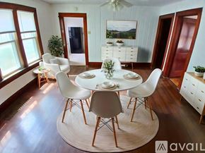 Muncie house for rent - A dining room with a white table and chairs.